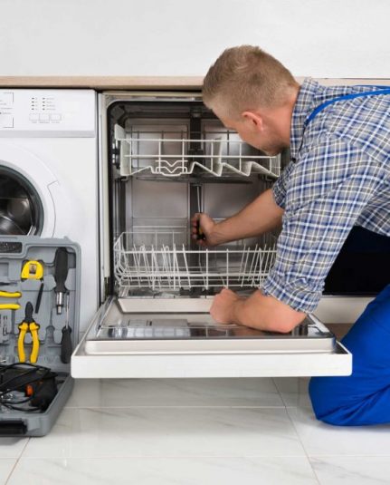 technician fixing a dishwasher repair brooklyn