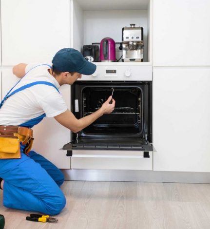 man repairing oven - About Brooklyn Appliance Repair Pros - Oven Repair Brooklyn